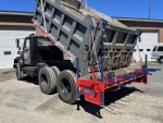 chip spreader Ameripatcher by PavementGroup shown with dump truck body in up position