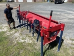 10' long Amerispreader shown with a man standing alongside 