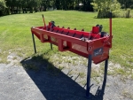 Amerispreader gravity spreader shown sitting with its 4 legs fully extended