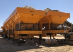 Two pavementgroup.com Olympus cold feed bins set side by side, receiving and conveying aggregate