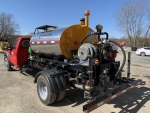 Pavementgroup Stratos DMS-600 truck mounted on ford f-550, rear view showing 12' spraybar with wing extensions folded down, file name dms-2000-1