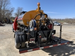 Pavementgroup Stratos DMS-600 truck mounted on ford f-550, rear view showing 12' spraybar with wing extensions folded up, file name dms-2000-5 dms-2000-2