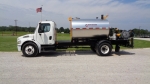 Stratos asphalt distributor truck, side view shown with a 2000 gallon emulsion tank, and platform between cab and tank