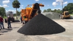 asphalt pugmill shown producing cold mix asphalt, discharge conveyor, 200tph pugmill mixer and 2 aggregate bins