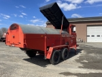 Asphalt recycling with the bagela asphalt recycler, shown here with loading bin up discharging asphalt millings into the the 10ton per hour drum. For sale as of 4/1/2024, call 518-218-7676 for details