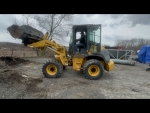 Kawasaki wheel loader for sale 2 for sale 518-218-7676 shown with wheel loader bucket in the air